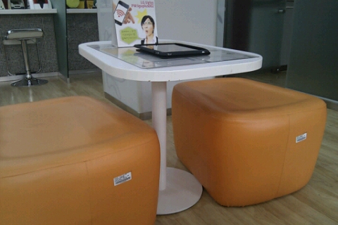 kb4 You'll find orange, green and yellow stools at this bank.